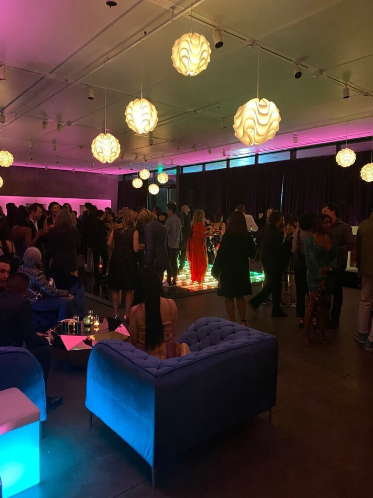 Picture shows the interior lounge of the 5th floor featuring a light up dance floor and round white lanterns hanging from the ceiling