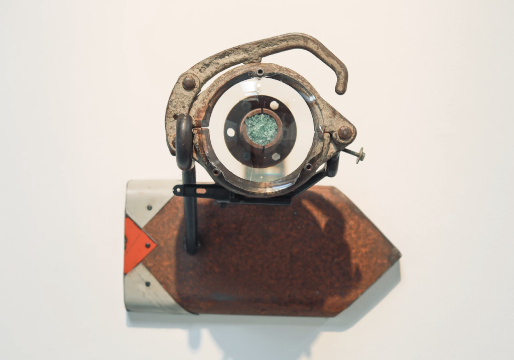 "Insight" by Brian Enright is made of scrap metal, found lens, broken auto glass and saw blades