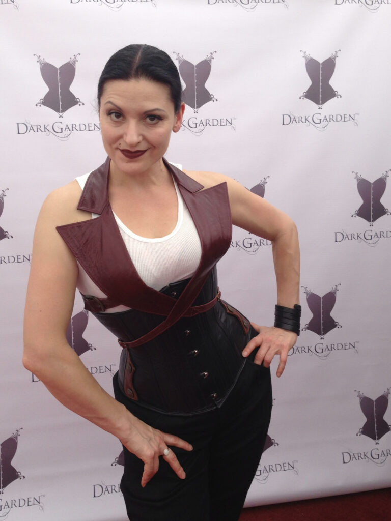 dark garden owner autumn a. poses in front of the dark garden step and repeat at folsom street fair, showing What to Wear to Folsom Street Fair