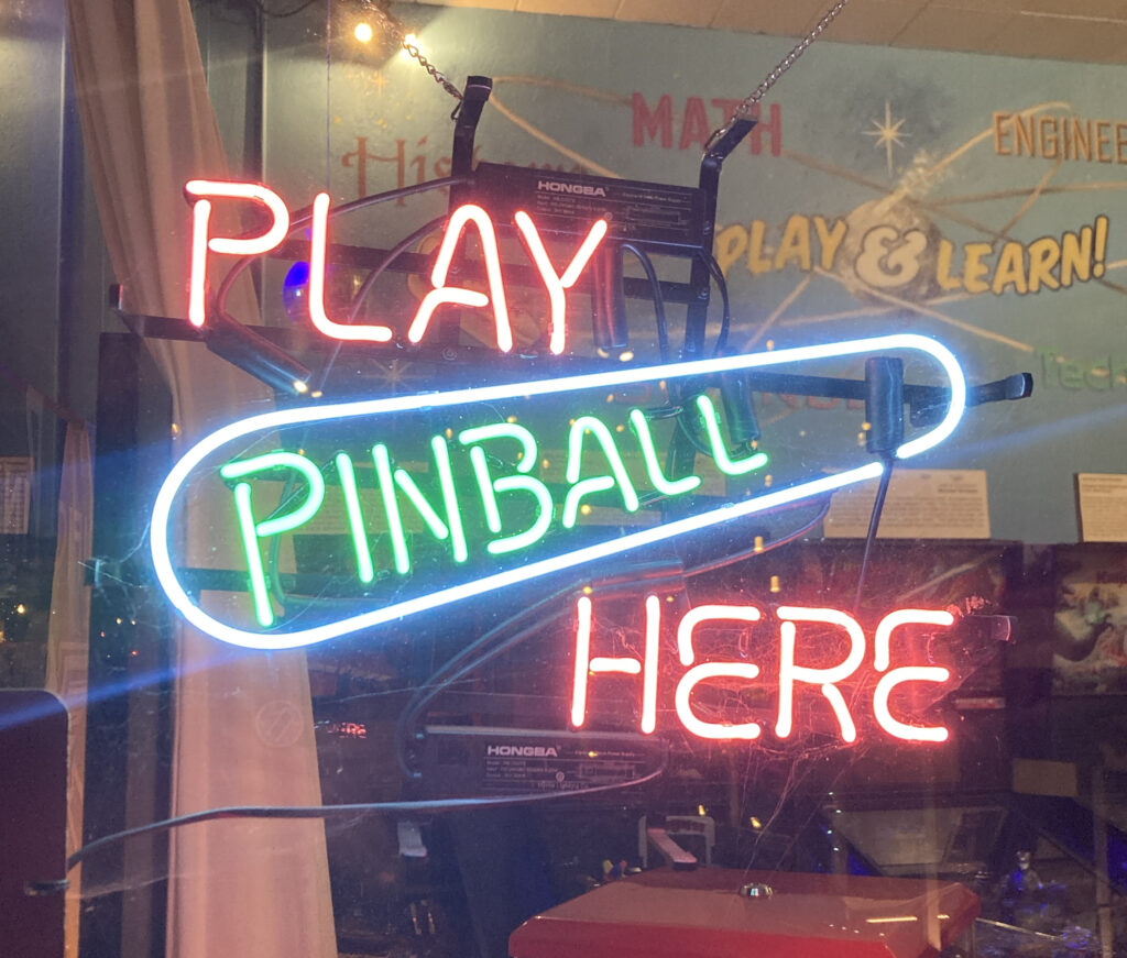 neon sign: play pinball here